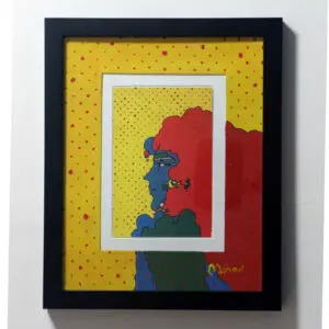 A framed art print of a woman's blue profile with red hair and a yellow background. Red polka dots in rows cover the image.