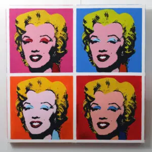 A pop art painting of Marilyn Monroe. Her head appears in bold colors in each quadrant.