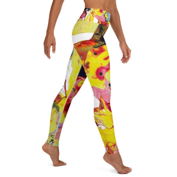 Yellow yoga leggings with abstract design of yellow, red, blue, and black.